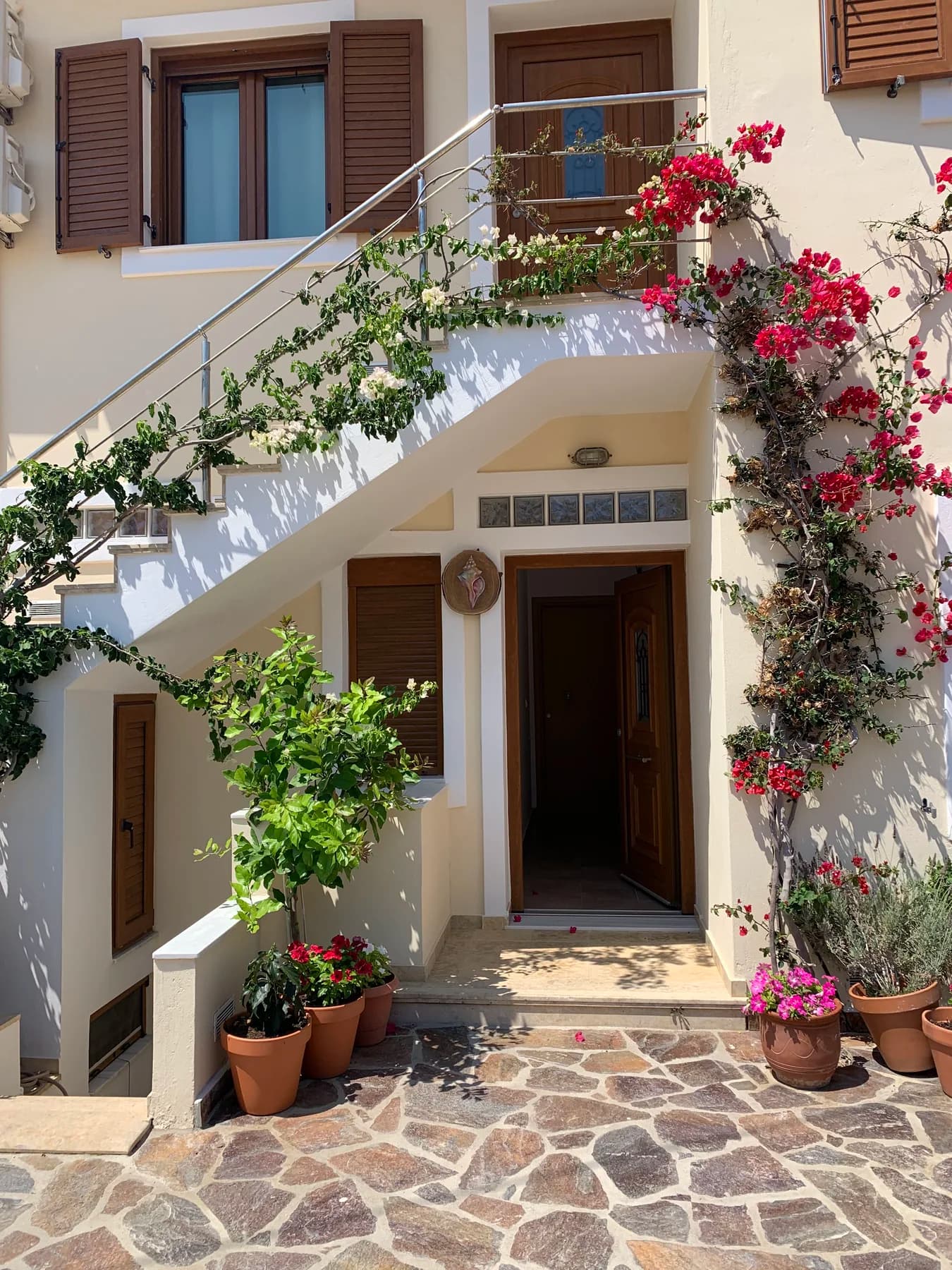 Flower-covered courtyard at Kochili Ikaria